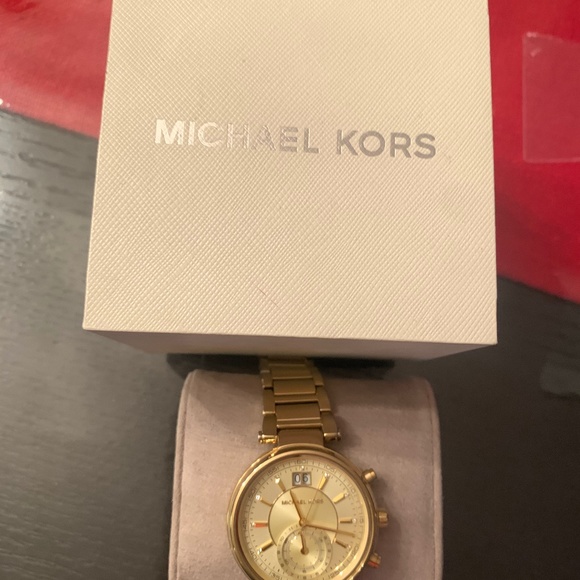 Women\'s gold Michael kors watch